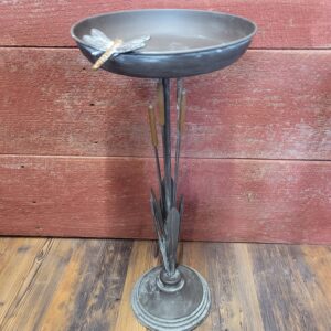 bird bath with cattails and dragonfly