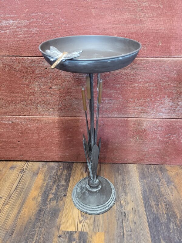 bird bath with cattails and dragonfly
